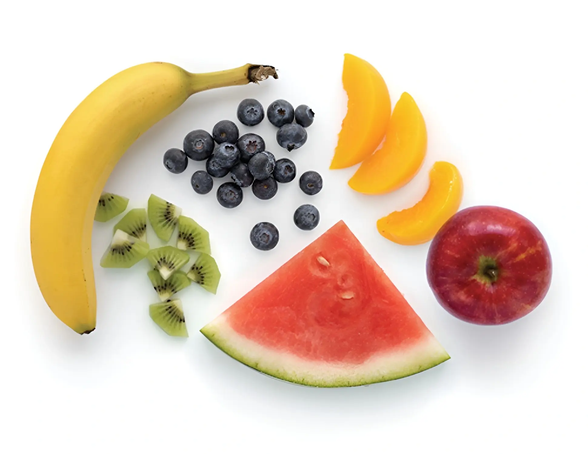 Assorted fruits including banana, apple, and watermelon