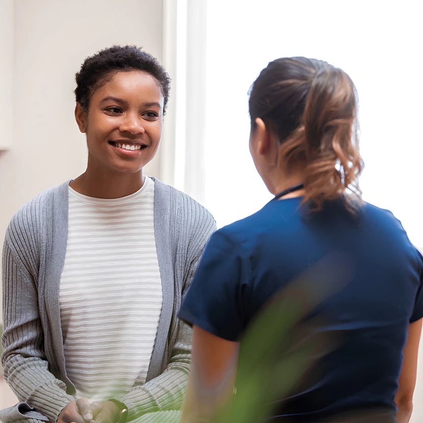 Woman smiling during doctors consultation