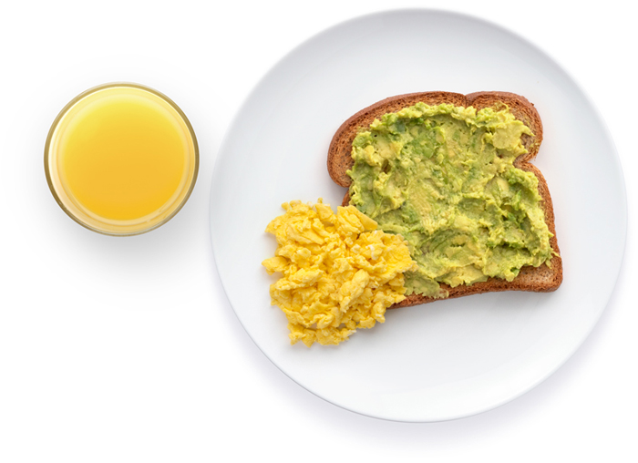 Avocado toast with scrambled eggs and orange juice