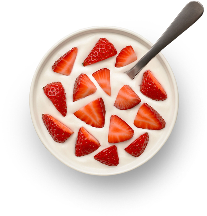Bowl of yogurt with sliced strawberries