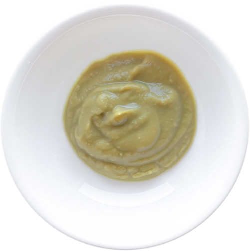 Mashed vegetables in white bowl