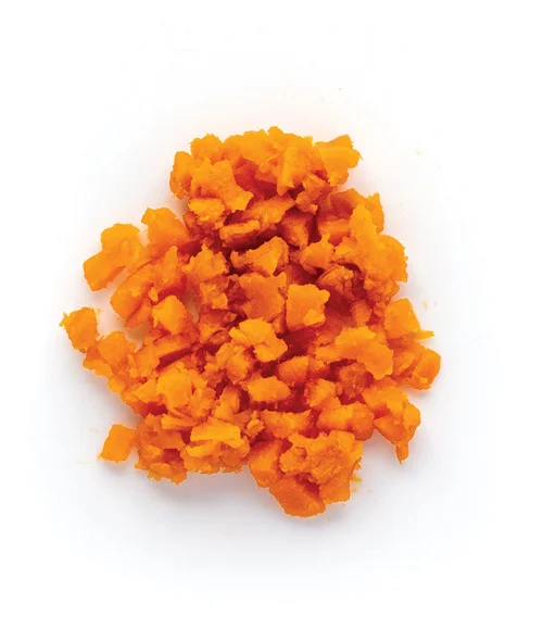Chopped sweet potatoes on white background