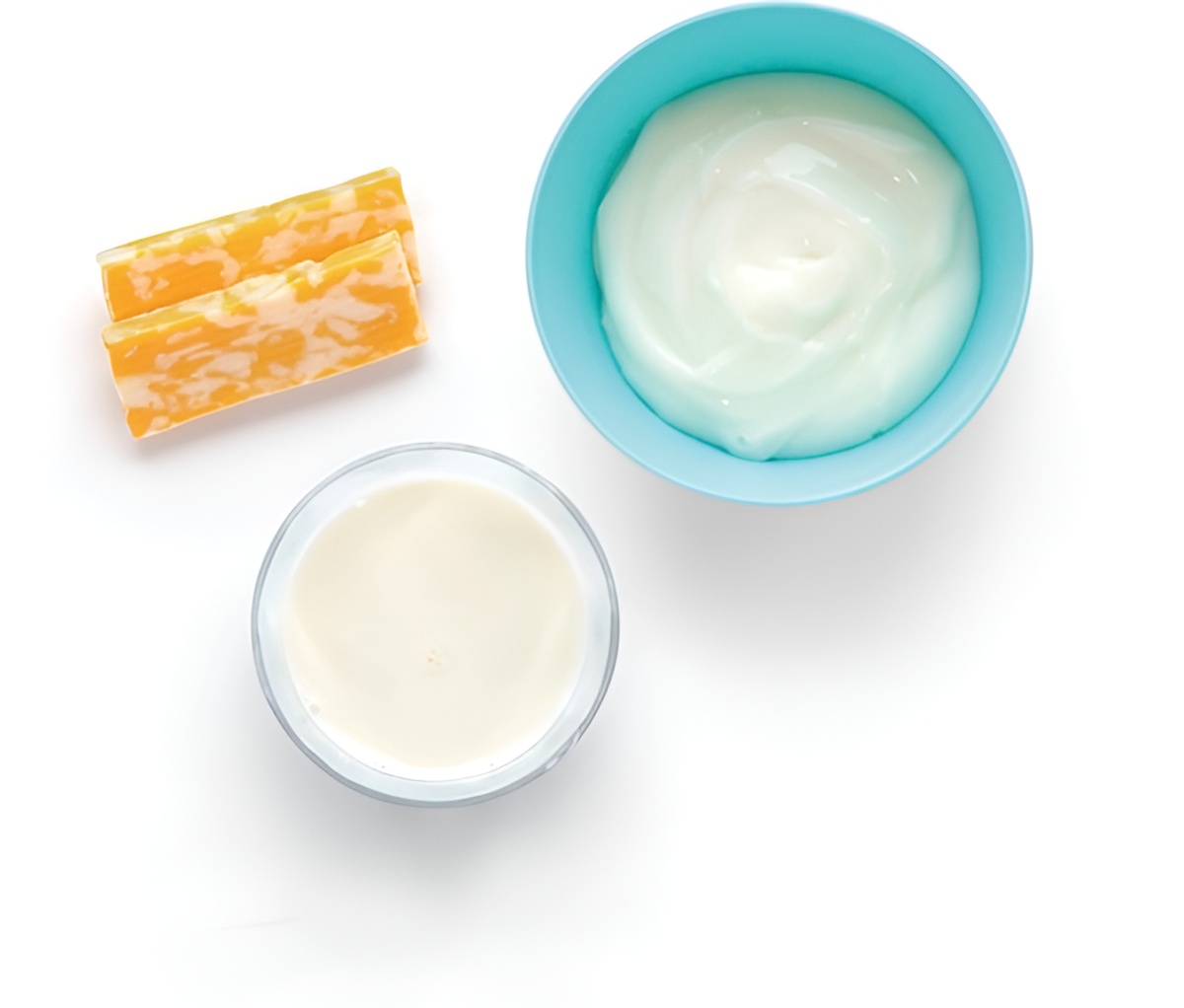 Cheese sticks, yogurt, and milk on white background