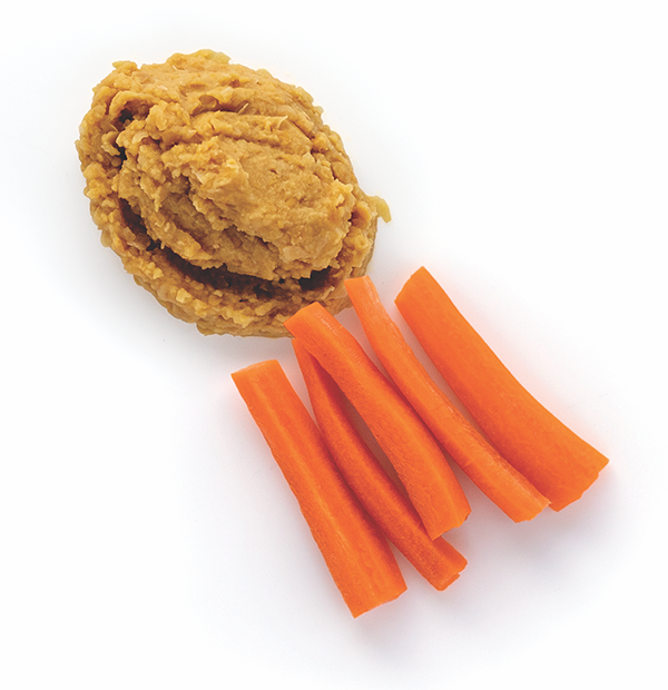 Mashed chickpeas with carrot sticks on white background