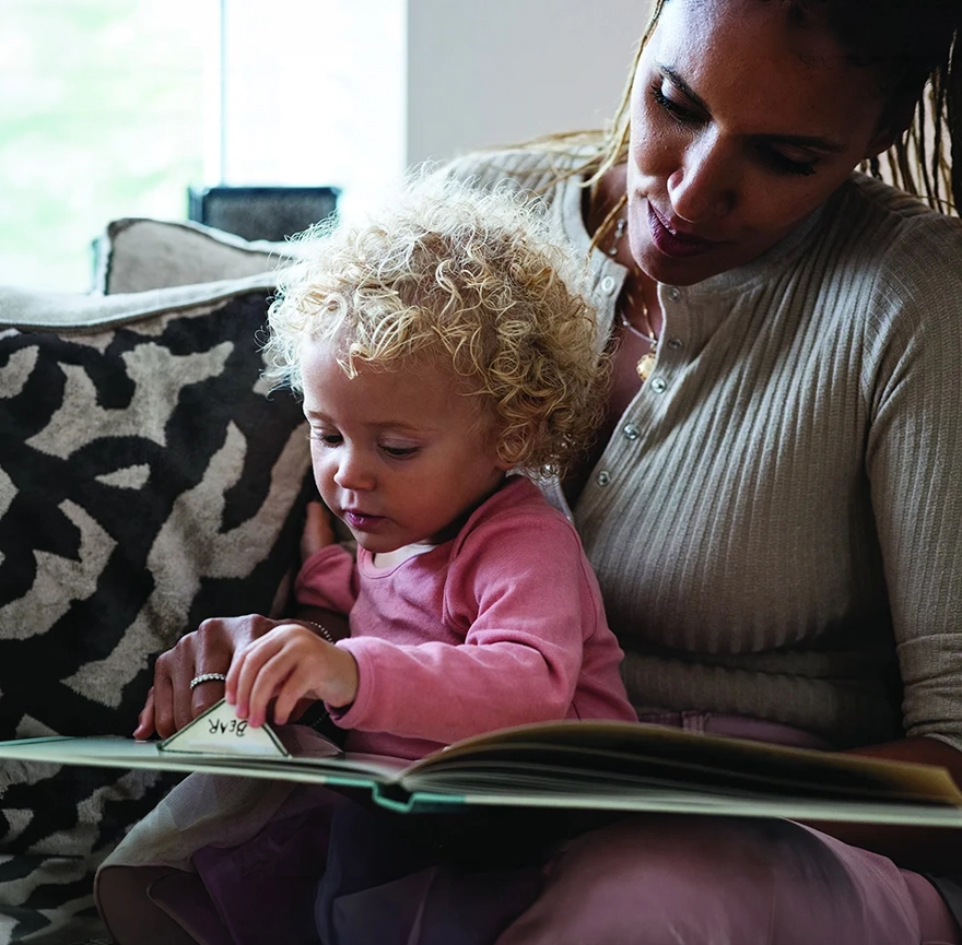 Toddler and mom enjoying a storybook together