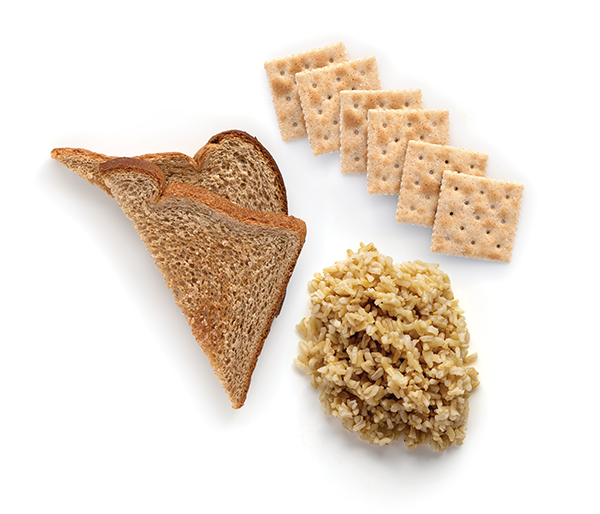 Bread, crackers, and rice on white background