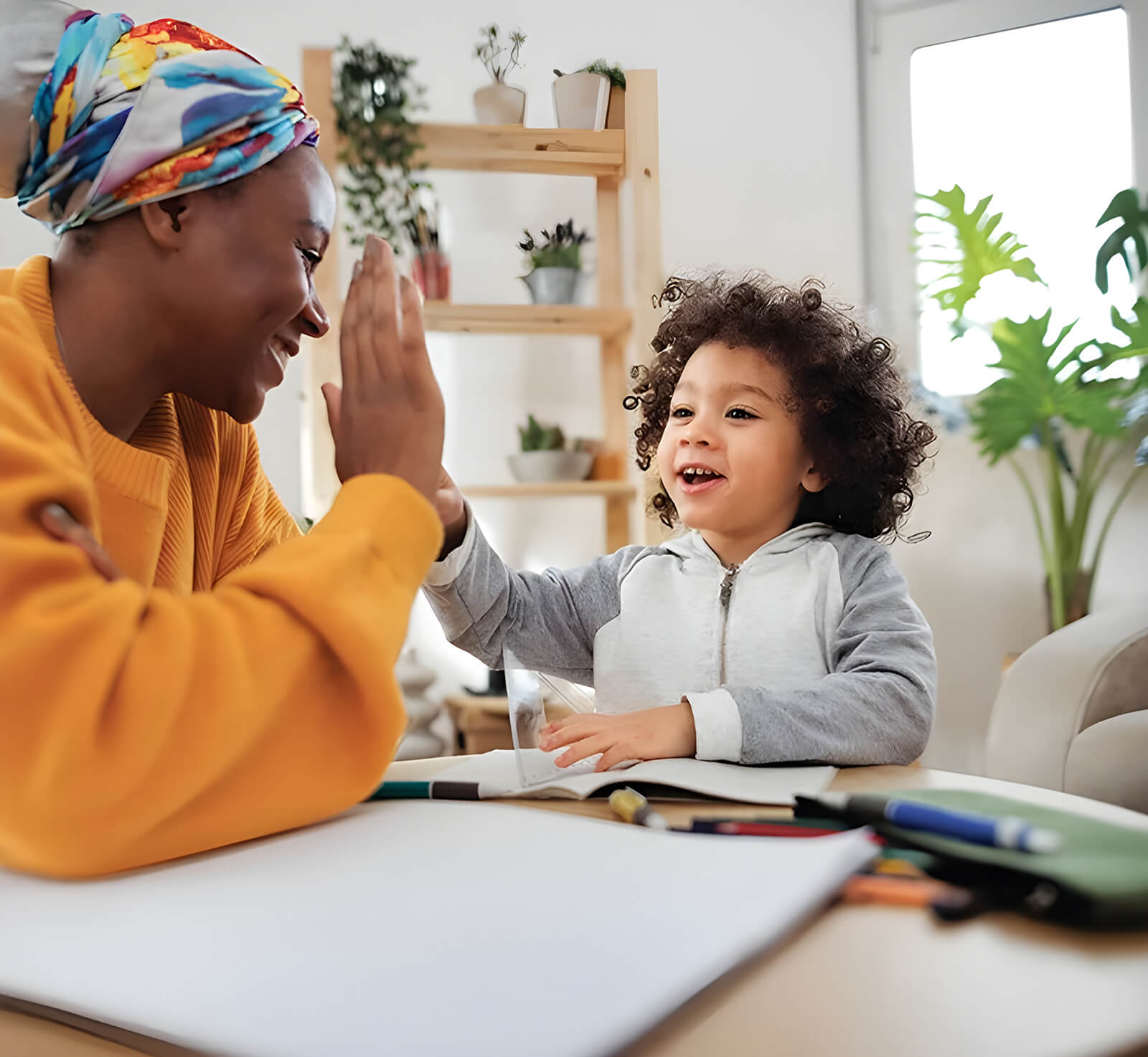 Woman and child giving a high five